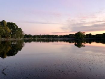 Scenic view of lake against sky during sunset