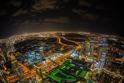 High angle view of illuminated city buildings at night