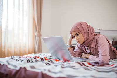 Young woman using mobile phone