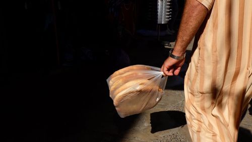 Low section of man working at market