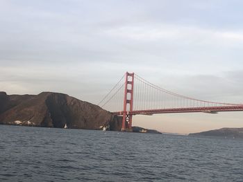 View of suspension bridge over sea