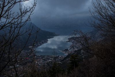 Scenic view of trees and mountains against sky