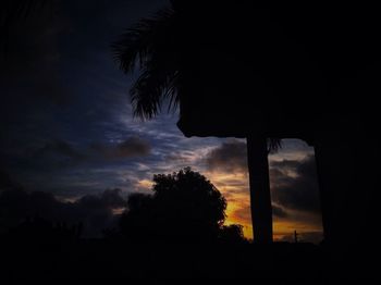 Silhouette of trees against sky at sunset