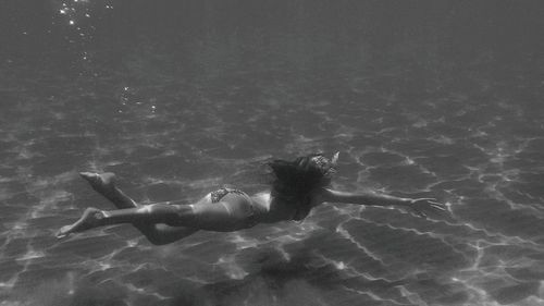 Woman swimming underwater