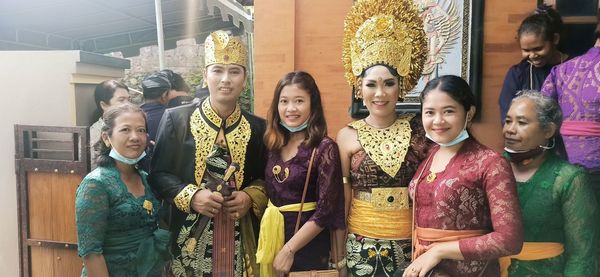 Group of people in traditional clothing standing outdoors