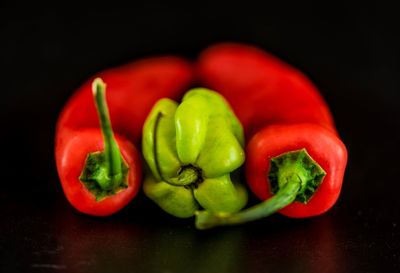 Close-up of bell peppers against black background