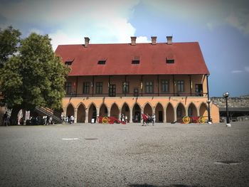 Building by street against sky