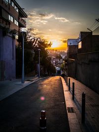 Buildings in city at sunset