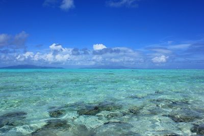 Scenic view of sea against cloudy sky