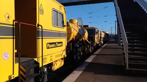 Train on railroad track against sky