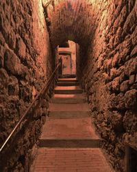 Narrow corridor along old building