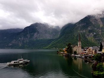 Scenic view of sea and buildings against sky