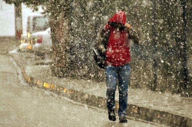 FULL LENGTH OF WET GIRL WALKING DURING WINTER