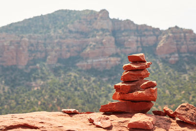 Stack of rocks against mountain