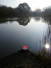 Scenic view of lake at sunset