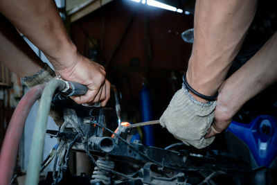 Low section of man working in workshop