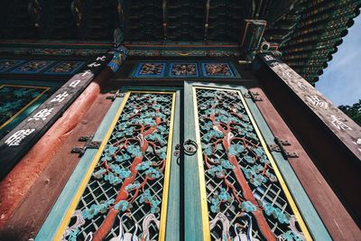 Low angle view of patterned door of buddhist temple