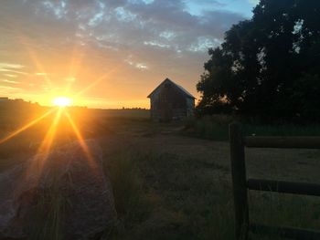 Scenic view of landscape against sky during sunset