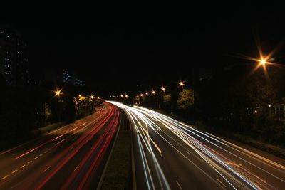 High angle view of light trails on road