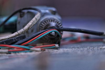 Close-up of drill machine on table