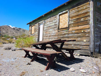 Picnic table by wooden house