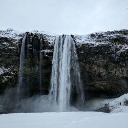 View of waterfall against sky