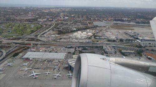 Cropped image of airplane flying over airport