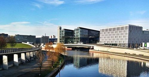 Bridge over river with buildings in background