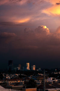 High angle view of buildings against sky during sunset