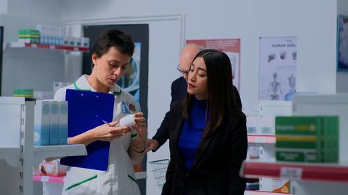 Portrait of smiling female friends working in office