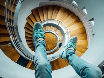 Low section of man on spiral stairs