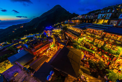 High angle view of illuminated buildings in city