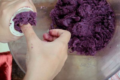 Close-up of hands preparing food