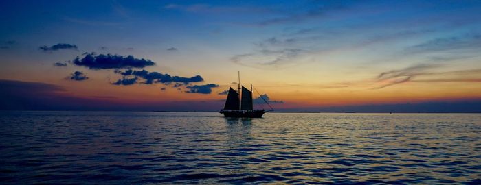 Silhouette of boat in sea