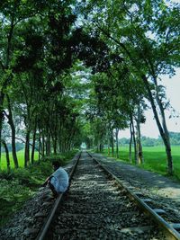 Side view of man sitting on track