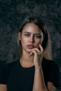 Portrait of young woman looking away