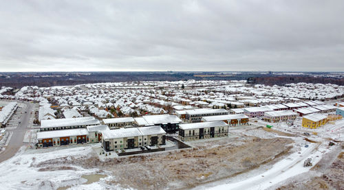 High angle view of snowcapped landscape against sky