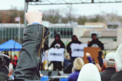 Cropped hand clenching fist during protest