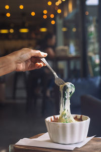 Midsection of person preparing food on table