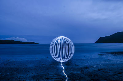 Wire wool at beach during night