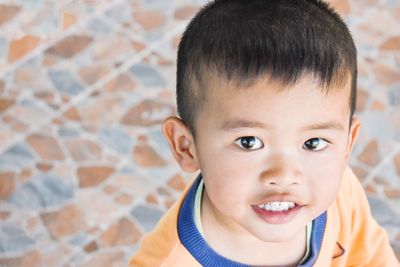 Close-up portrait of cute boy at home