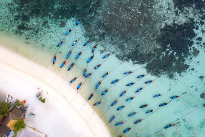 High angle view of people by sea