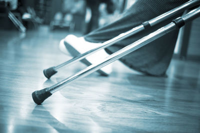 Close-up of walking canes on hospital corridor