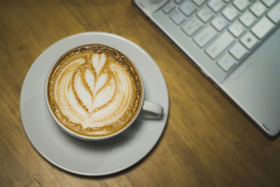 Close-up of cappuccino on table