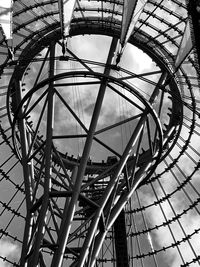 Low angle view of ferris wheel against sky