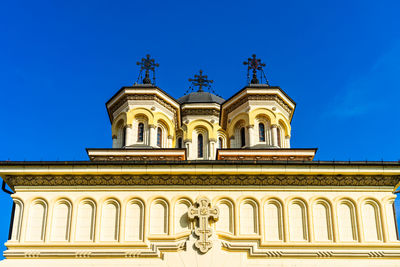 Low angle view of cathedral against clear blue sky