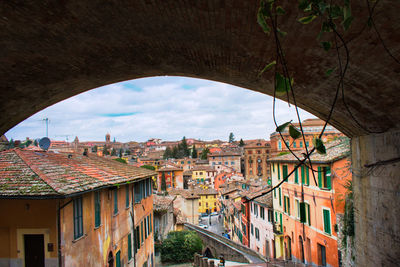 Buildings in city against sky