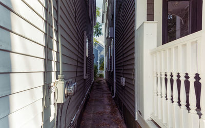 Empty alley amidst buildings in city