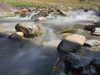Surface level of stream flowing through rocks
