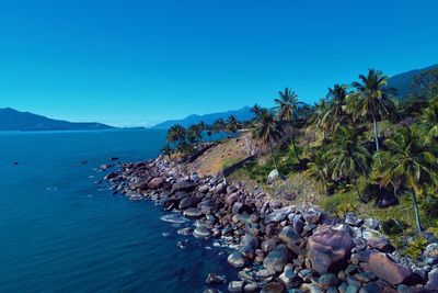 Scenic view of sea against clear blue sky